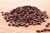 Coffee grains on brown background
