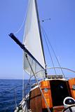 Sailing with an old sailboat over mediterranean sea