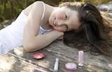 beautiful young girl with make up set outdoors