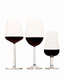 Three glasses of red wine isolated on white background