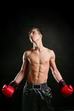 young shaped man boxing in studio