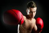fit young man boxing