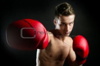 fit young man boxing