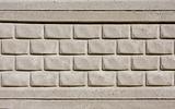 Concrete textured tiled brick wall