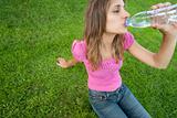 Woman drink water grass