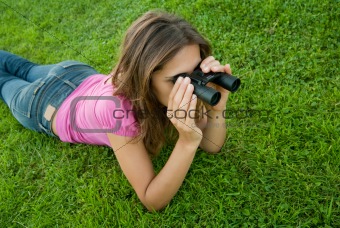 Woman binocular lenses grass