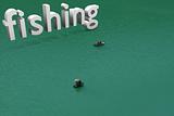 small boats with typographic incrustation of fishing