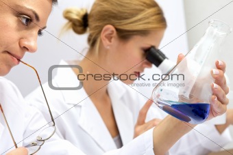 Two Femal Scientists Working Together