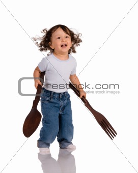 child with big spoon and fork 