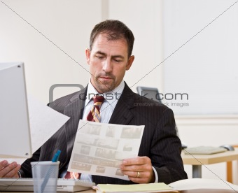 Businessman reviewing paperwork