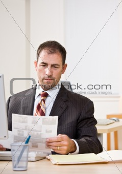 Businessman reviewing paperwork