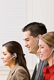 Business people talking on headsets