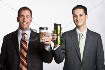 Businessmen holding coffee cups