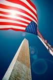 The Washington monument with a US flag