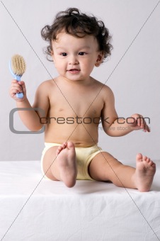 Baby with comb.