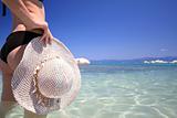  woman with hat on the beach