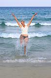 Happy young woman in sea