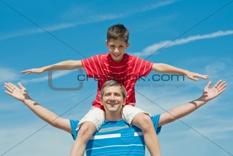father and his son plays outdoors