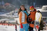 Lucky couple  snowboarders  in a mountain valley