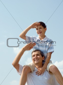 father and his son play outdoor