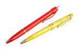 Yellow and red ball point pens.