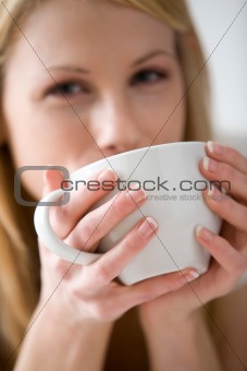 Woman Drinking From Coffee Cup