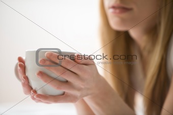 Woman Holding a Coffee Cup