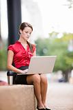 Businesswoman Sitting Outside With Laptop