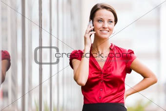 Woman outside talking on her cell phone