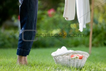 Woman's Legs and Laundry Basket