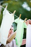 Woman Hanging Clothes To Dry