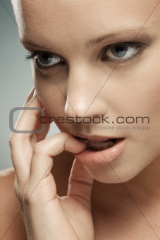 Close-up of Woman With Hand to Face