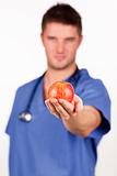 Young doctor holding an apple