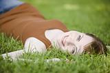 Woman lying down of grass