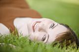 Woman lying down of grass