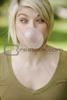 Woman blowing a bubble