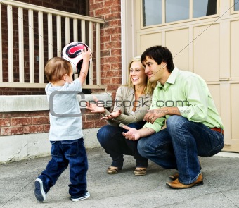 Family playing with soccer ball