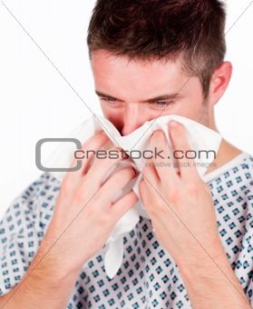 Patient with flu using a tissue