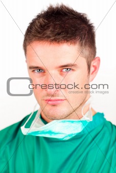 Serious surgeon looking at the camera