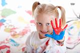 child shows painted hand