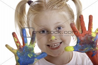 child is painting with hands