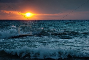 Stormy sunsrise on the sea