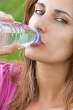 Woman drink water grass