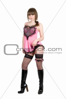Playful girl in a pink dress and black boots