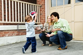Family playing with soccer ball