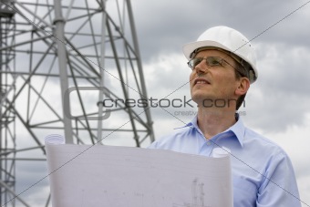 Engineer with blueprint