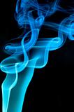 Abstract blue smoke over black background
