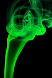 Abstract green smoke over black background