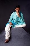 Hindu man sitting and thinking