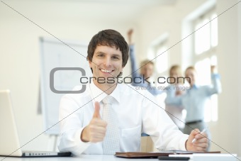 Successful Businessteam with thumbs up